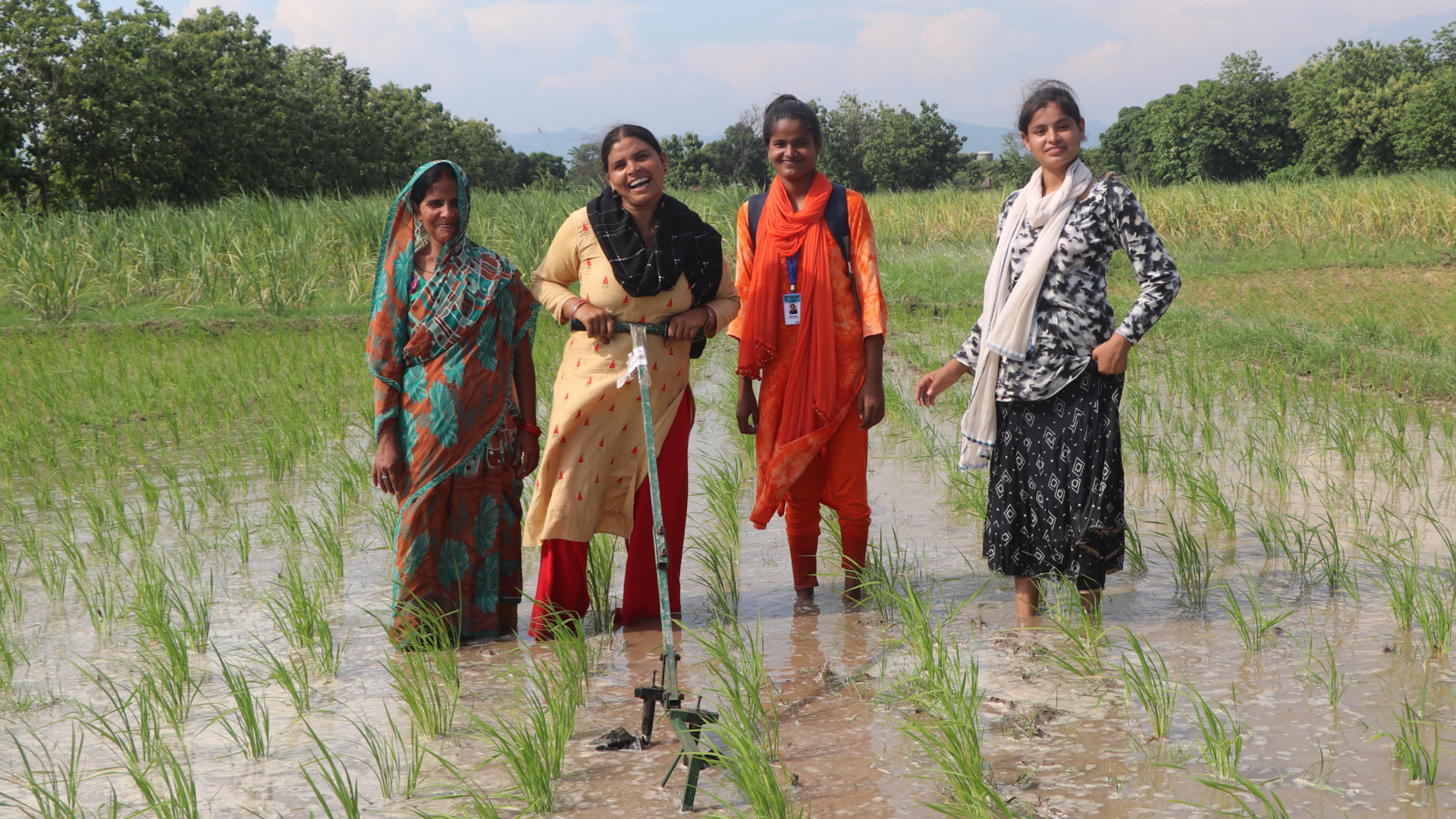 Four women stood in field
